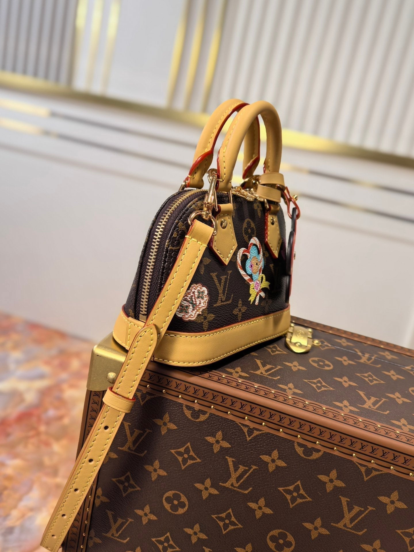 LOUIS VUITTON LV 25S NANO ALMA 18 IN BROWN MONOGRAM CANVAS PRINTED WITH THE VIVIENNE MASCOT