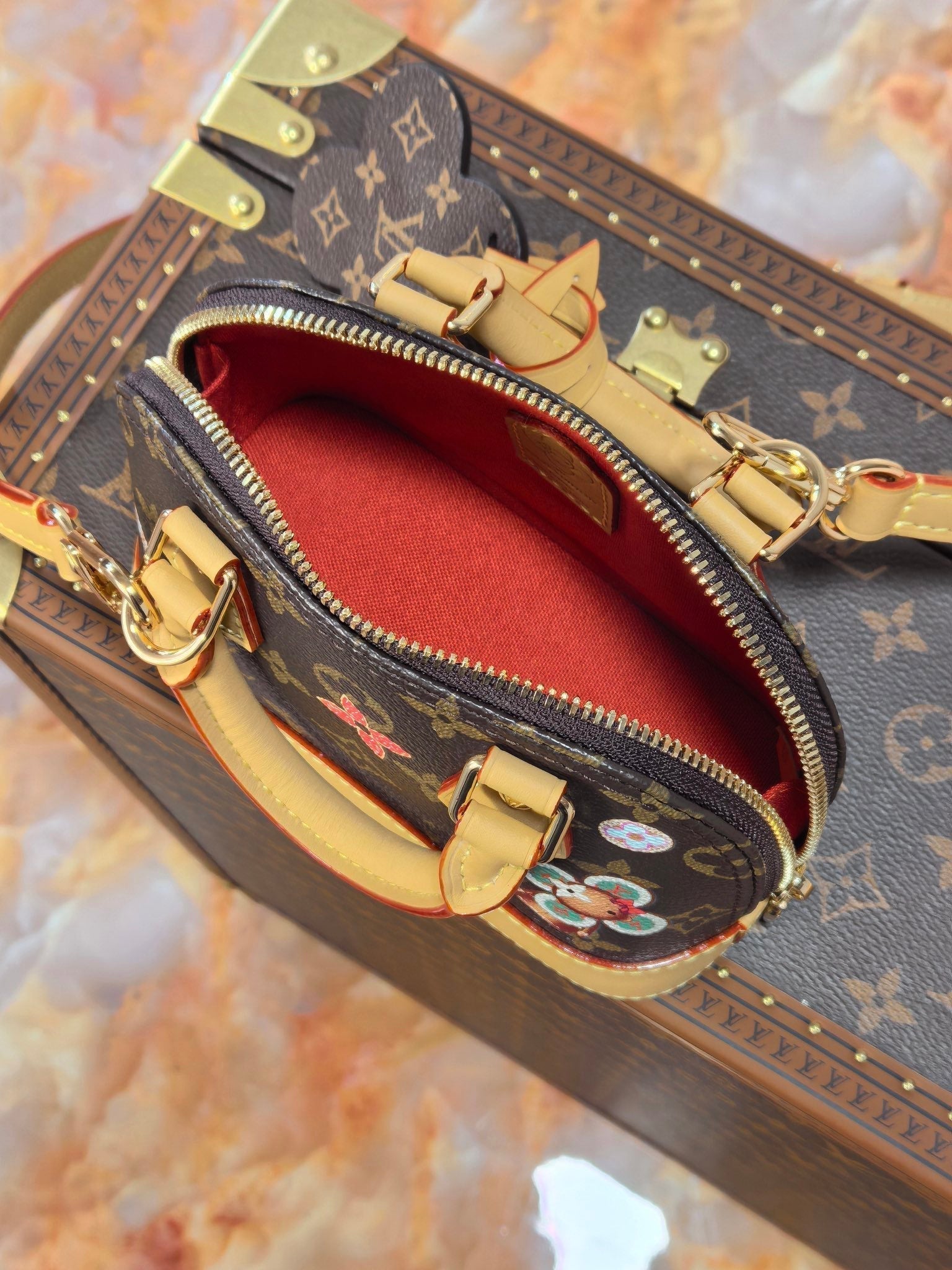 LOUIS VUITTON LV 25S NANO ALMA 18 IN BROWN MONOGRAM CANVAS PRINTED WITH THE VIVIENNE MASCOT