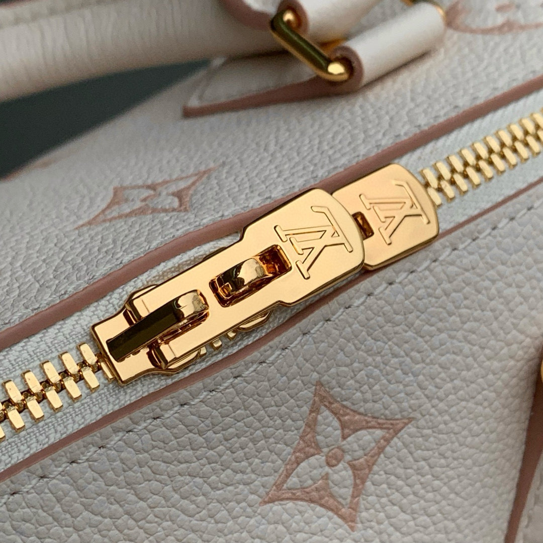 LOUIS VUITTON SPEEDY BANDOULIÈRE 20.5 IN LIGHT PINK MONOGRAM EMPREINTE CANVAS